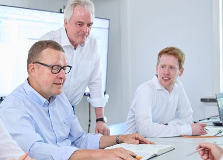 group of engineers sitting at the conference table